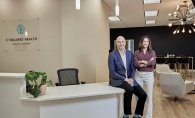 Chris and Lauren Schultheis in the lobby of E Squared Health