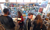 Patrons browse a booth at the Plymouth Arts Fair.