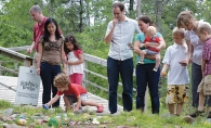 A family visits Sophia's Bridge of Hope at Faith's Lodge.