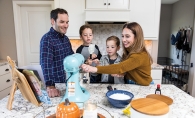 Brad, Gabe, Jonah and Rachel Ingber making a cookie recipe from the book she made for her grandmother-in-law.