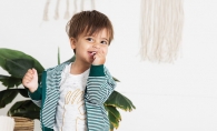 A child models organic clothes from online boutique Lulie Kids.