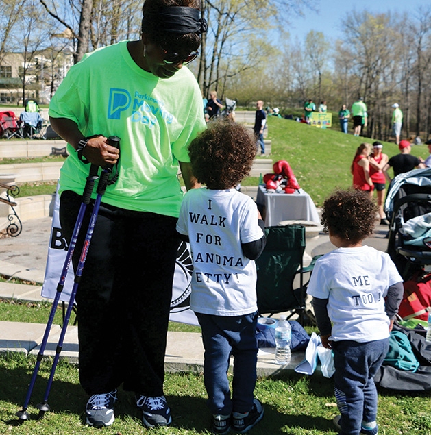 Two children walk with their grandmother at the Parkinson's Foundation's Moving Day.