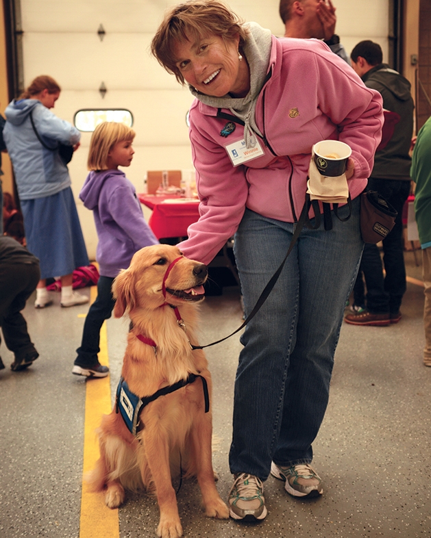 Mary Tiegan with Winnie of Helping Paws