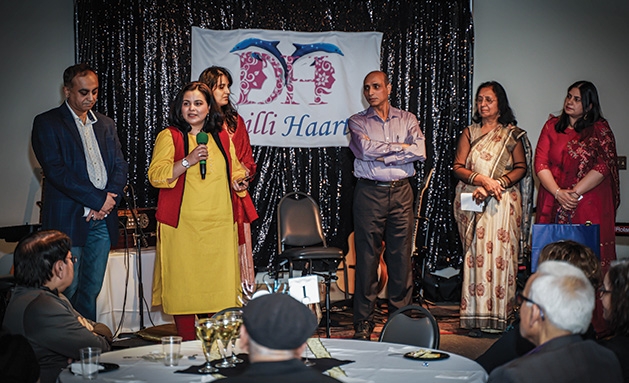 Sunil Puri, SEWA-AIFW staff, Raj Chaudhary and Sonia Puri at the DilliHaart appreciation dinner.