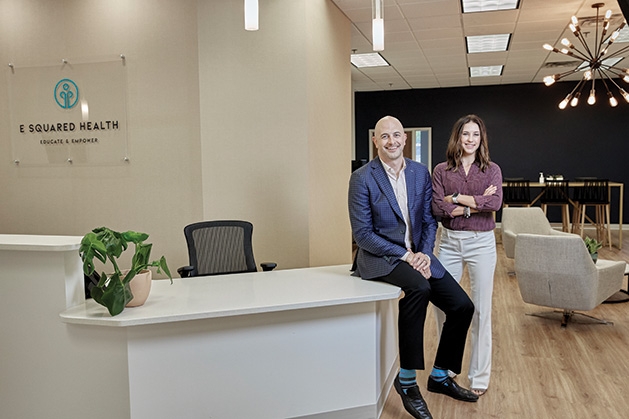 Chris and Lauren Schultheis in the lobby of E Squared Health