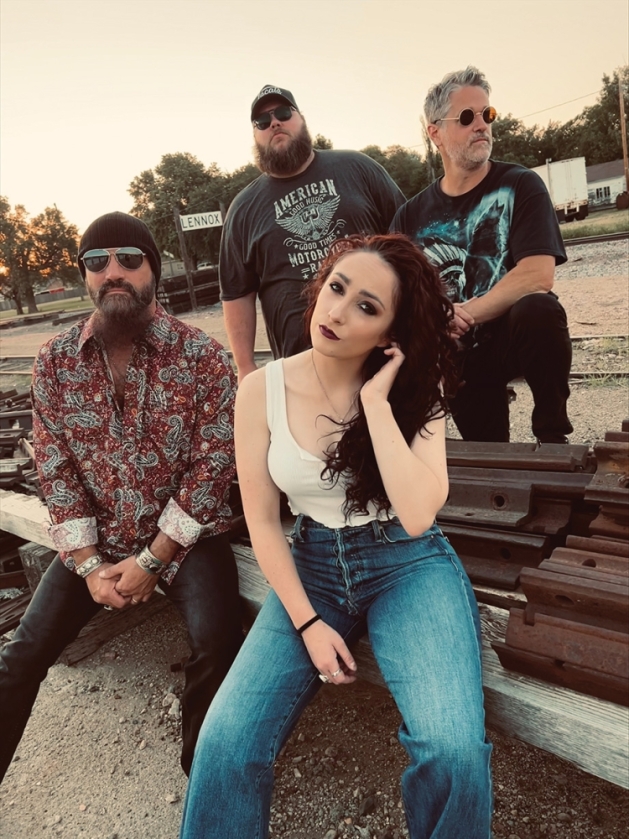 The Devon Worley Band members posing outside.