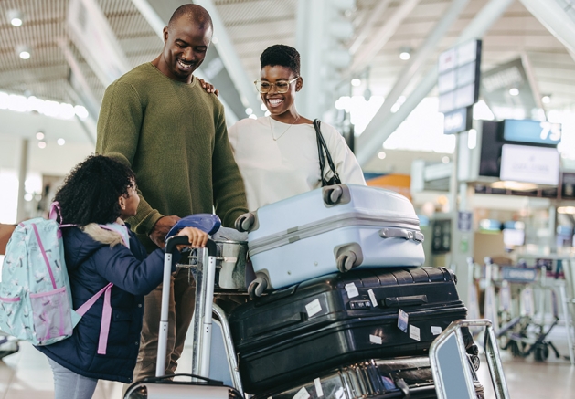 A family traveling at the airport.