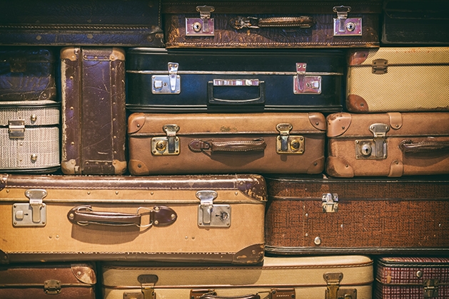 stack of vintage hard-sided luggage