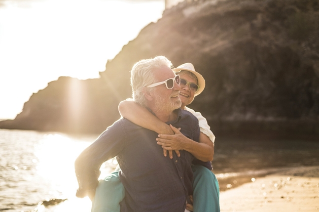 Couple on vacation wearing sunglasses.