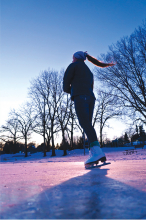 A girl ice skating on the Parkers Lake ice rink