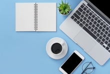 A desk is set up with all of the necessary supplies for working from home.