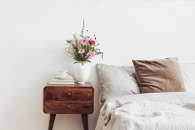 Bouquet of flowers on bedside nightstand