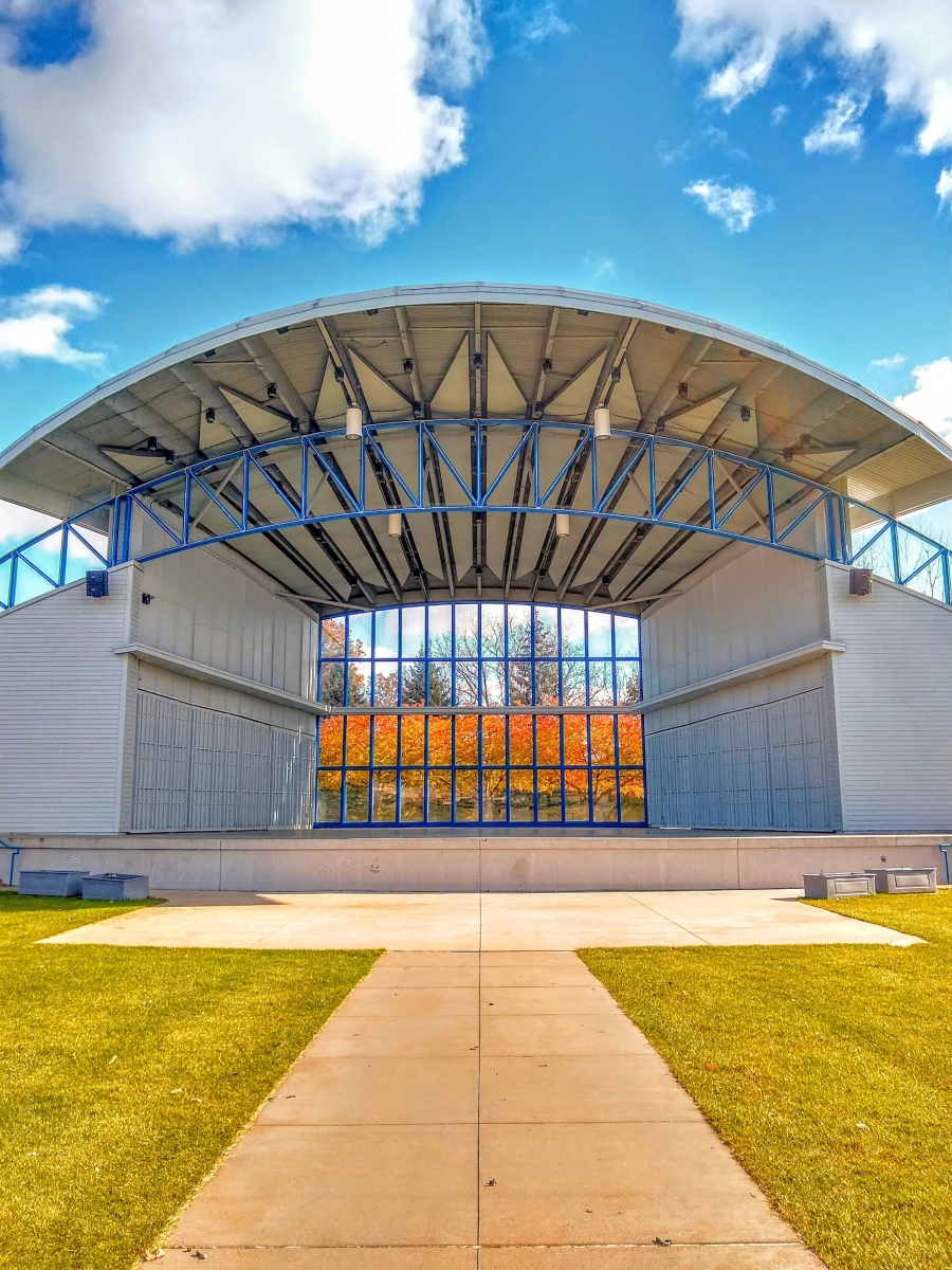 Looking through Hilde Performance Center's bandshell to find Fall Foliage